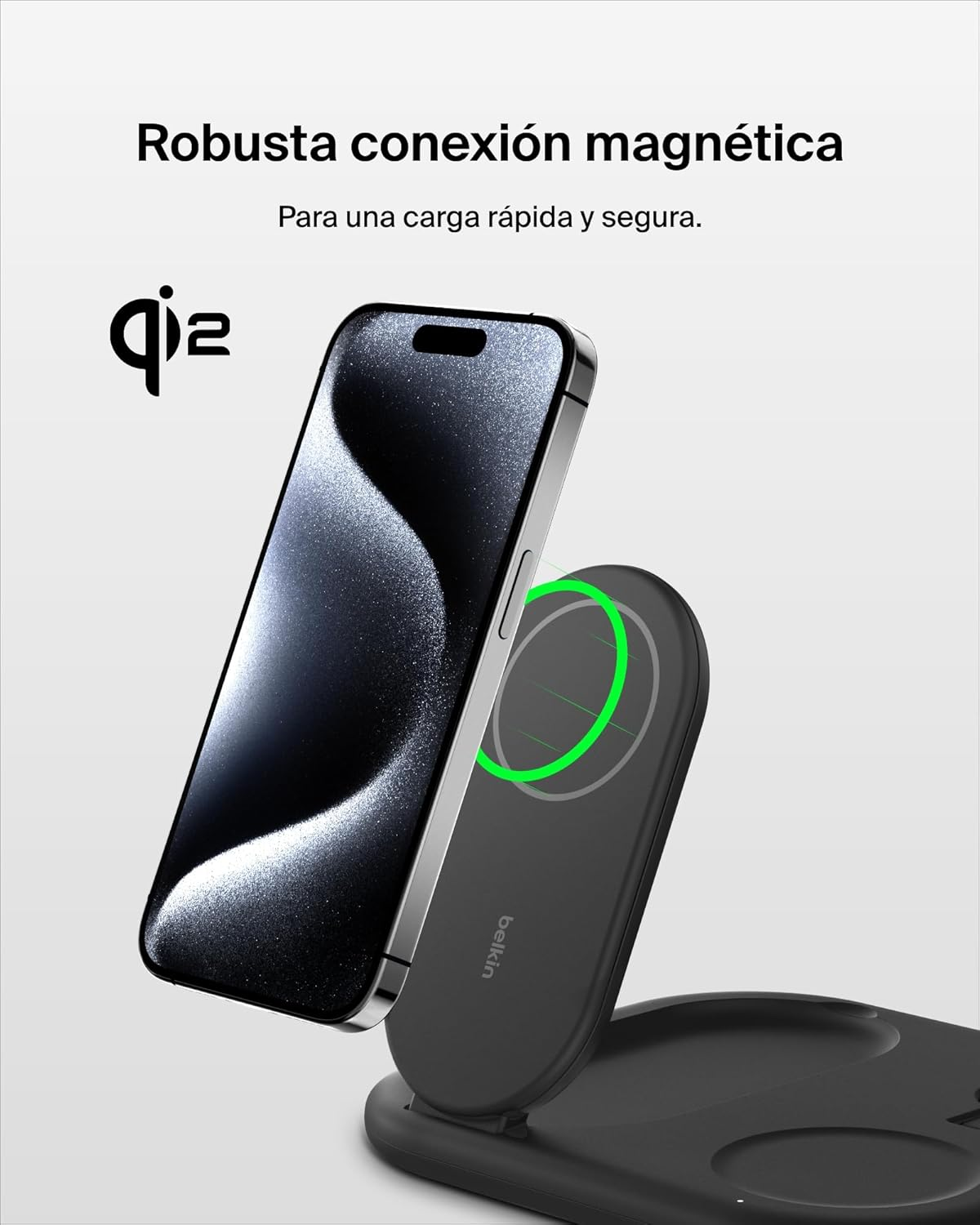 Stazione di ricarica wireless nera. Il telefono è in carica, con un cerchio di ricarica verde.