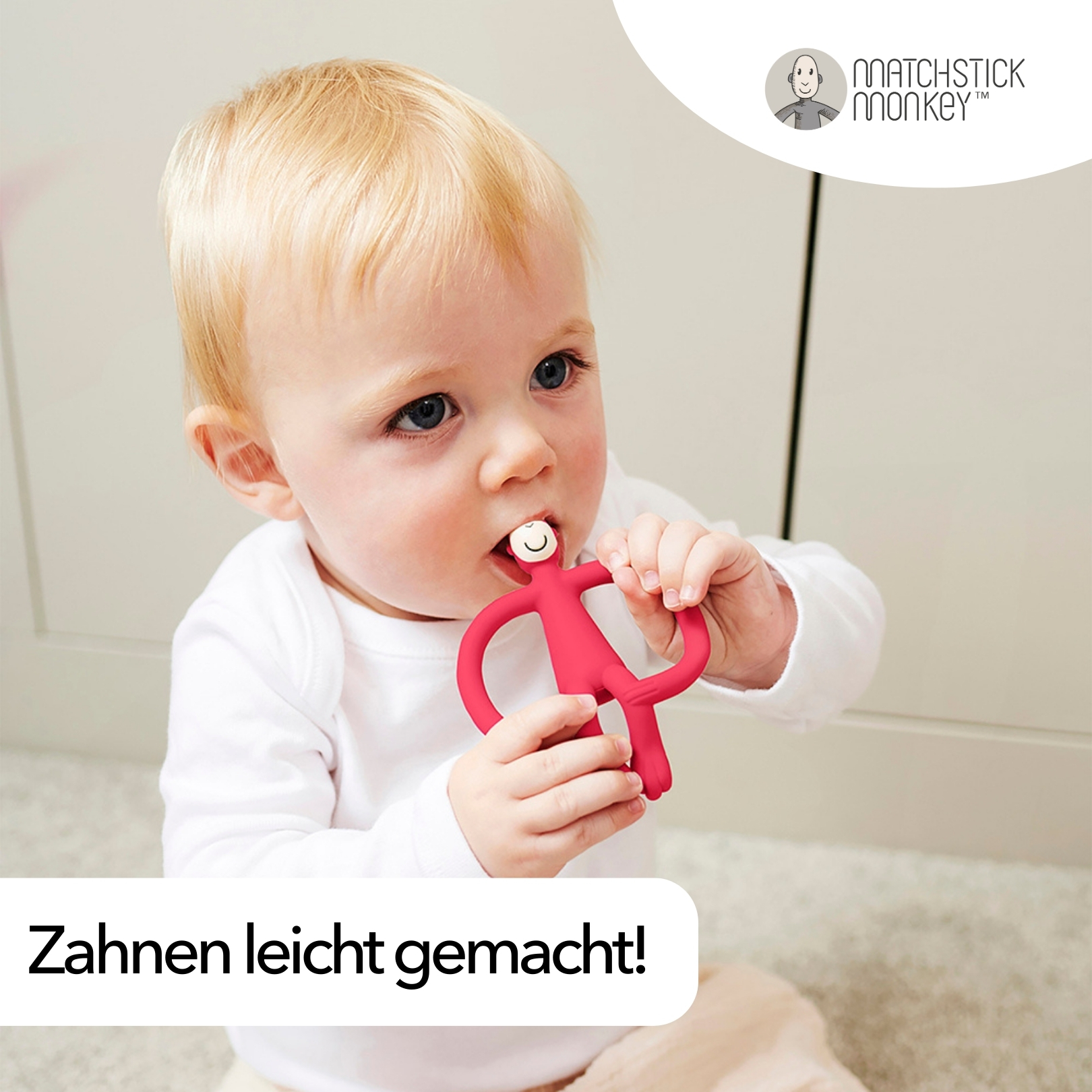 Baby kaut auf rotem Beißring. Text: Zahnen leicht gemacht! (Zahnen leicht gemacht!)
