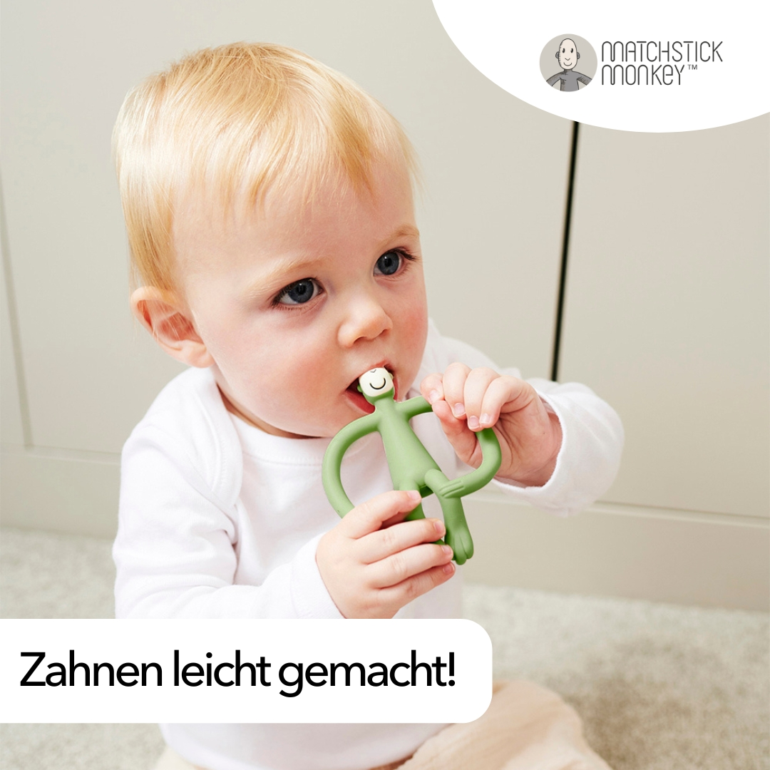 Baby mit grünem Beißring. Text: Zahnen leicht gemacht!