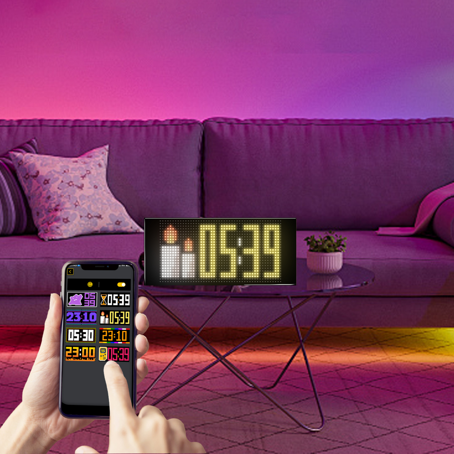 Digitaluhr mit Zeit- und Kerzenanzeige auf einem Tisch, mit Telefonsteuerung.