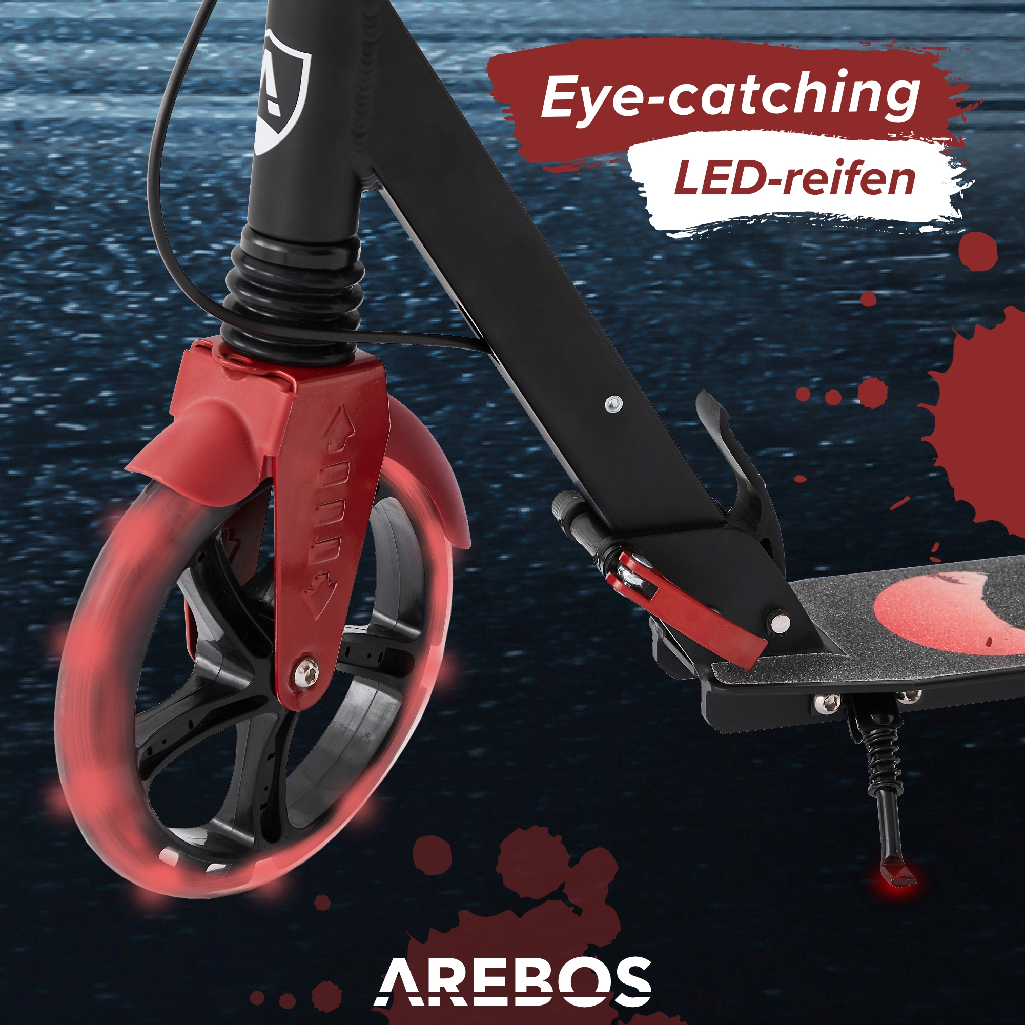 Nahaufnahme eines rot-schwarzen Roller-Rads mit roten LED-Leuchten.
