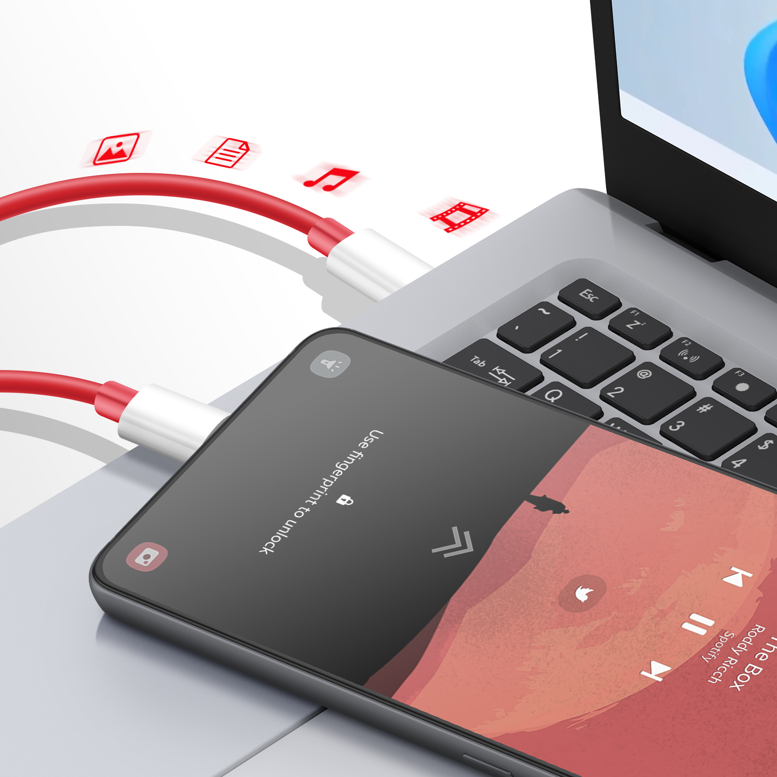 Telefon połączony z laptopem za pomocą czerwonego kabla. Ikony muzyki i danych.