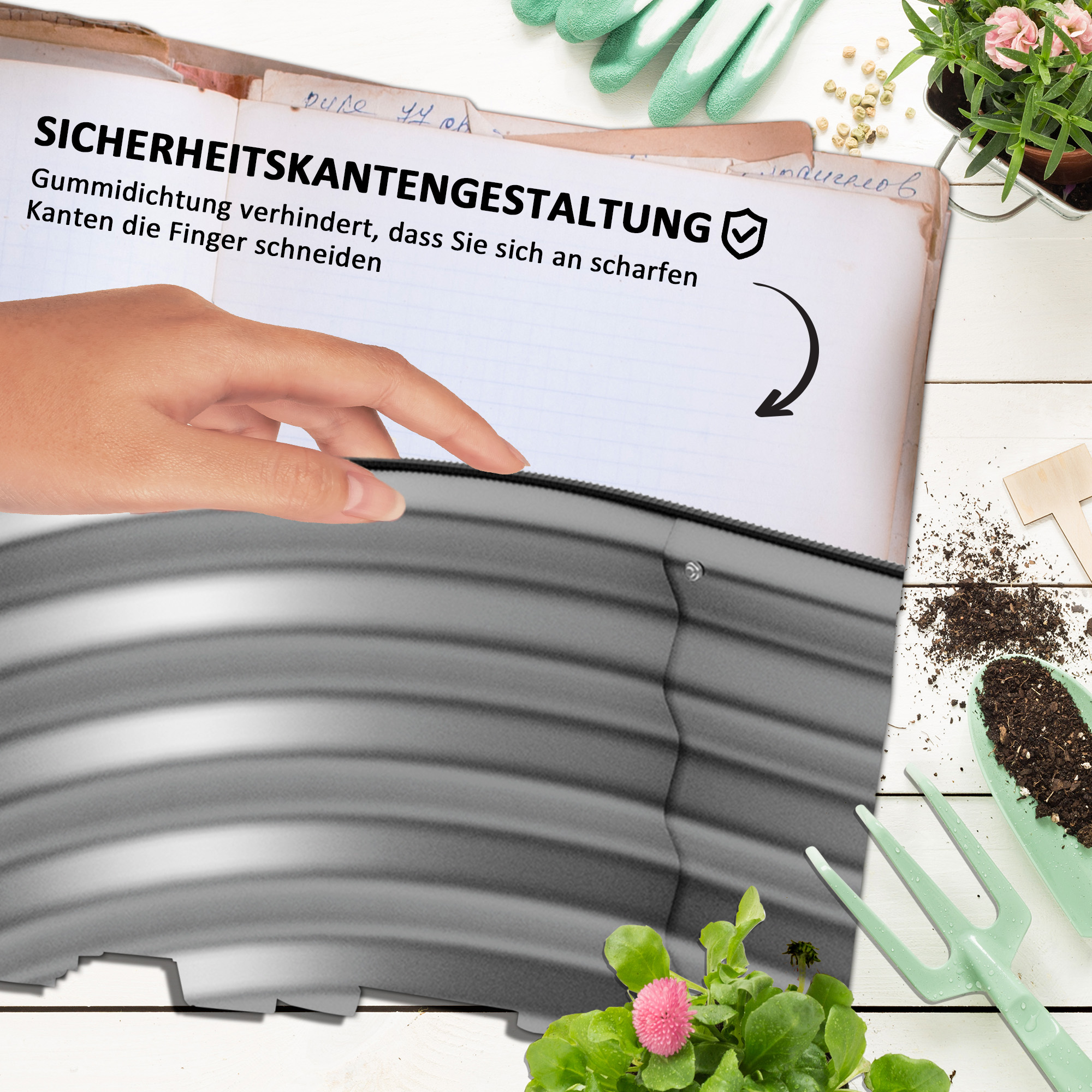 Eine Hand zeigt auf den Rand eines metallenen Gartenbetts und hebt Sicherheits- und Designmerkmale hervor.