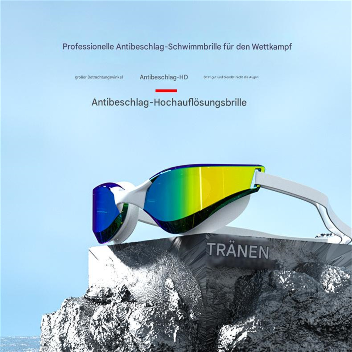 Schwimmbrille mit grünen und blauen Gläsern, auf Felsen liegend, mit Text.