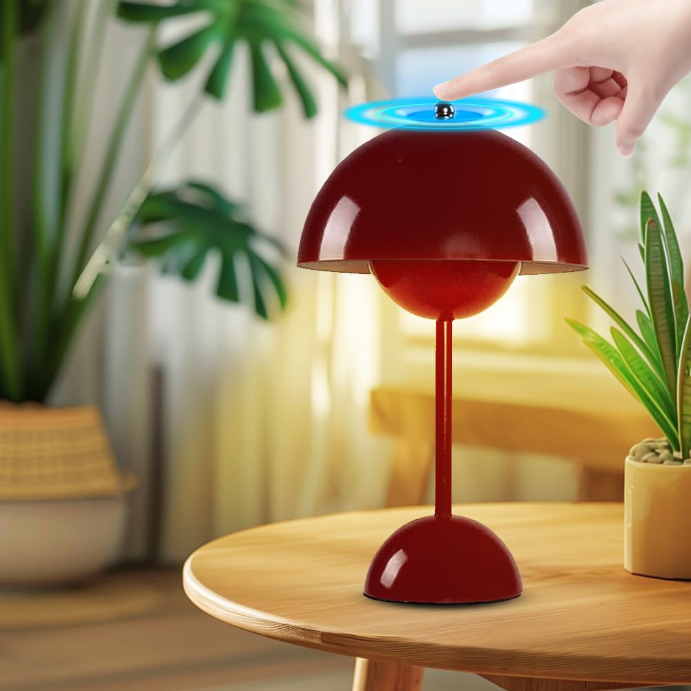Eine rote Tischlampe mit berührungsempfindlicher Oberseite. Ein Finger berührt die Oberseite, mit blauem Leuchten.