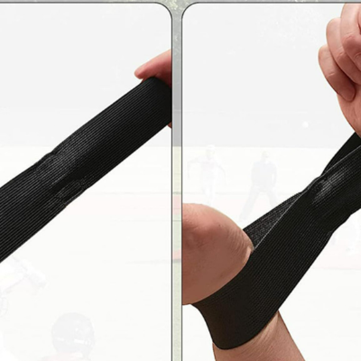 Manicotto nero in due pannelli. Una mano tiene il pannello superiore. Il braccio di una persona che lo indossa.