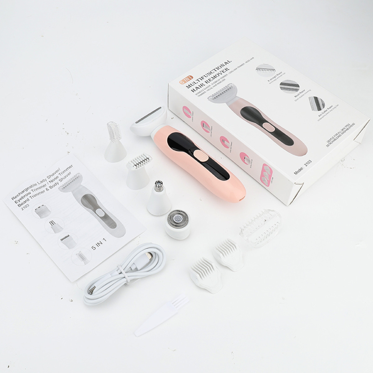 Zestaw narzędzi i urządzeń do usuwania włosów, w tym różowo-biała golarka elektryczna i akcesoria.