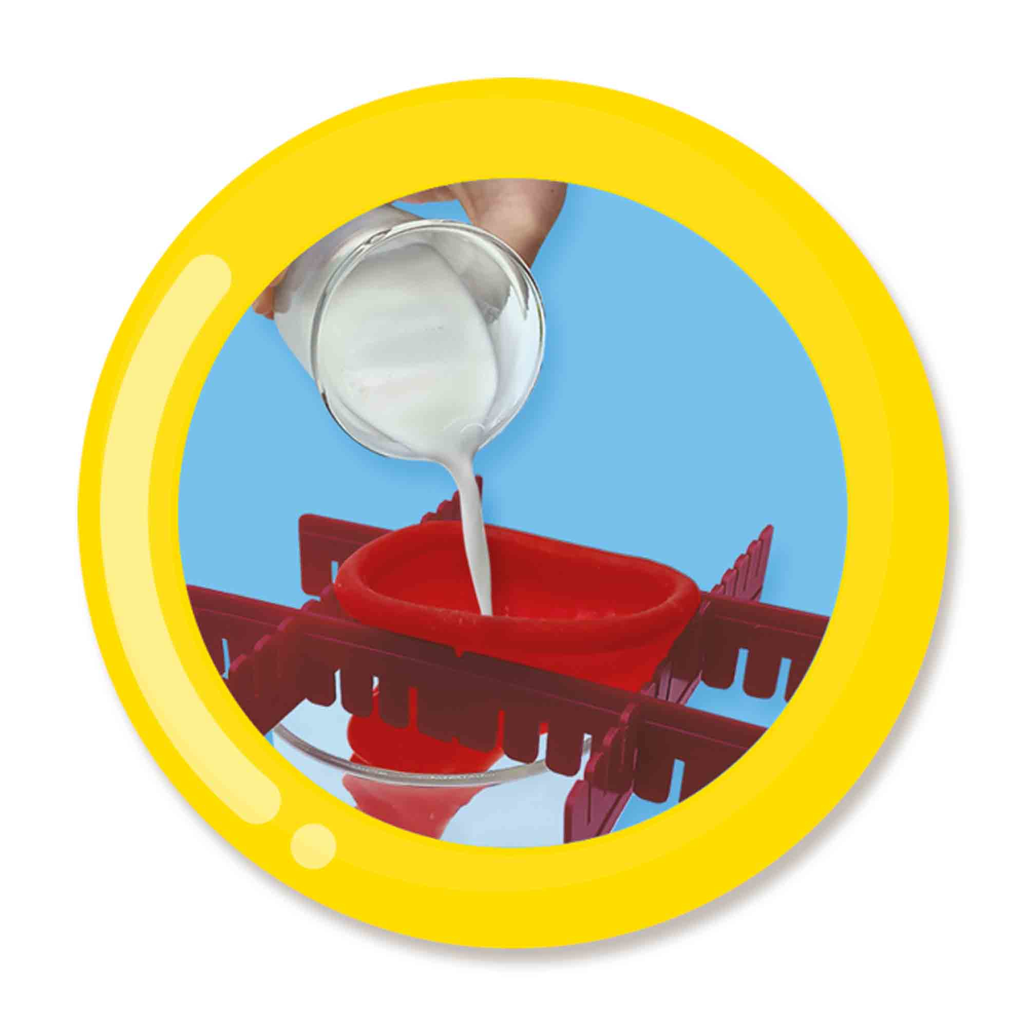 Ręka wlewa białą ciecz do czerwonego obiektu w kształcie lejka, wewnątrz żółtej okrągłej ramy.