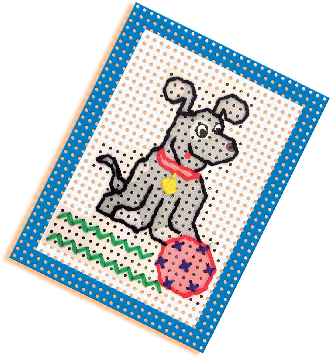 Ręka haftuje psa na kartce. Pies jest szary, z czerwoną obrożą.