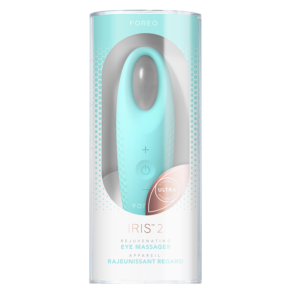 A blue Foreo Iris 2 eye massager in a transparent tube. The device has buttons.