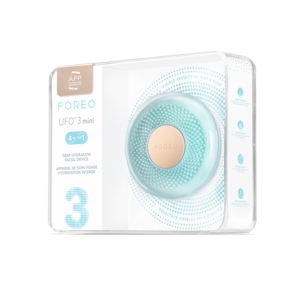 FOREO UFO™ 3 mini cihazı ambalajda, şeffaf kutu, mavi cihaz.