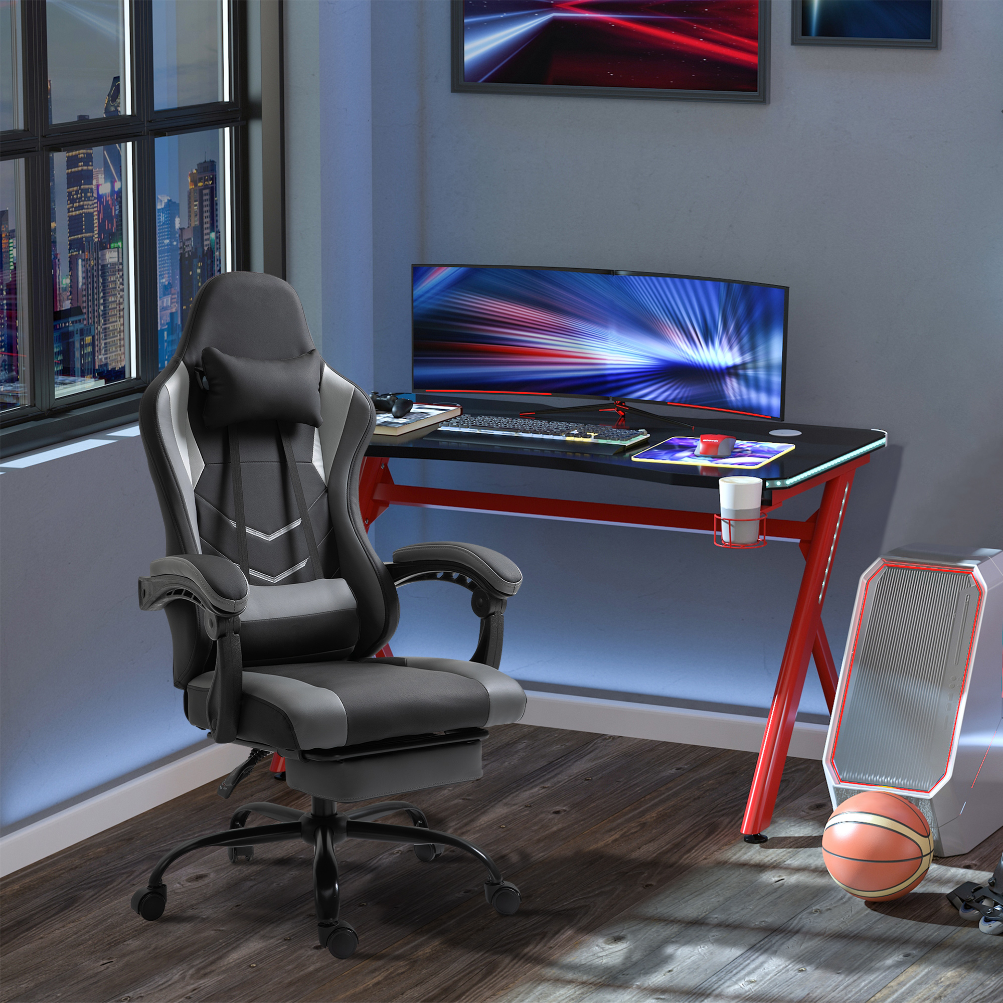 Gaming-Setup mit Stuhl, Schreibtisch, Monitor und verschiedenem Gaming-Zubehör.