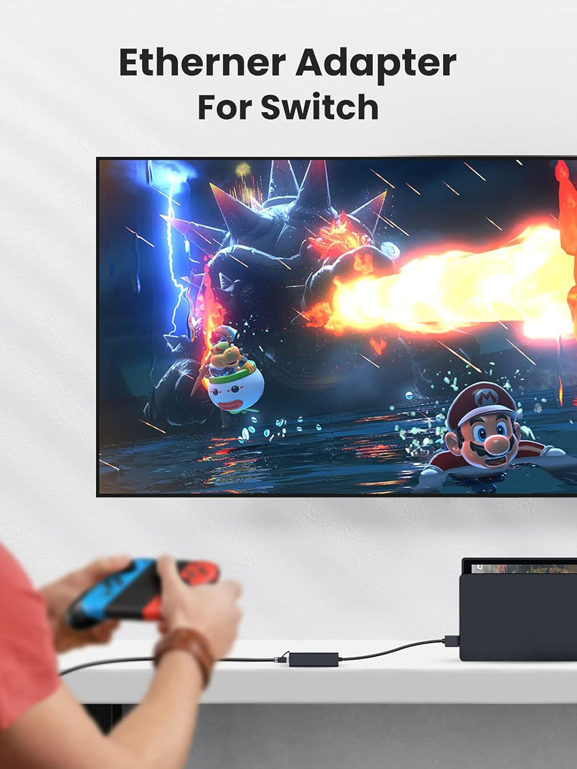 Person spielt Nintendo Switch, verbunden mit einem Fernseher, mit schwarzem Ethernet-Adapter.