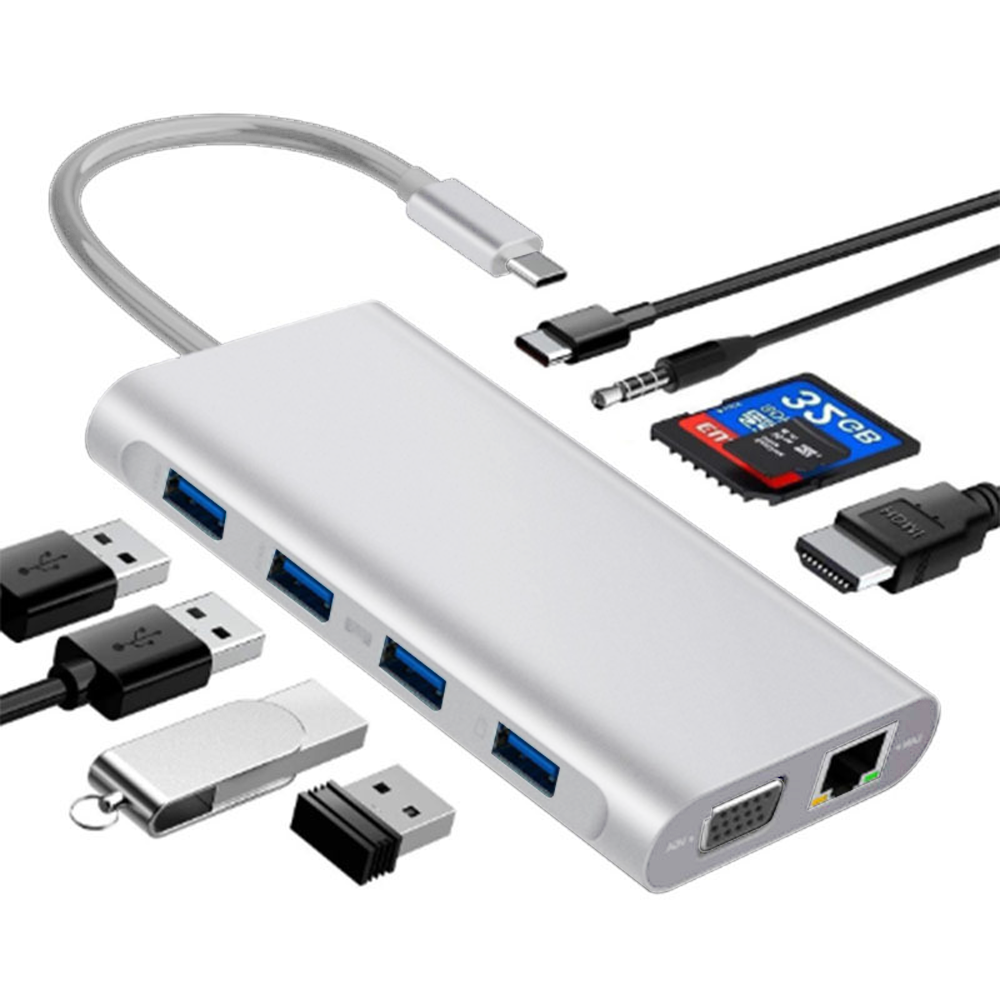 Ein silberner USB-Hub mit mehreren Anschlüssen und angeschlossenem Zubehör, darunter Kabel und Speichergeräte.