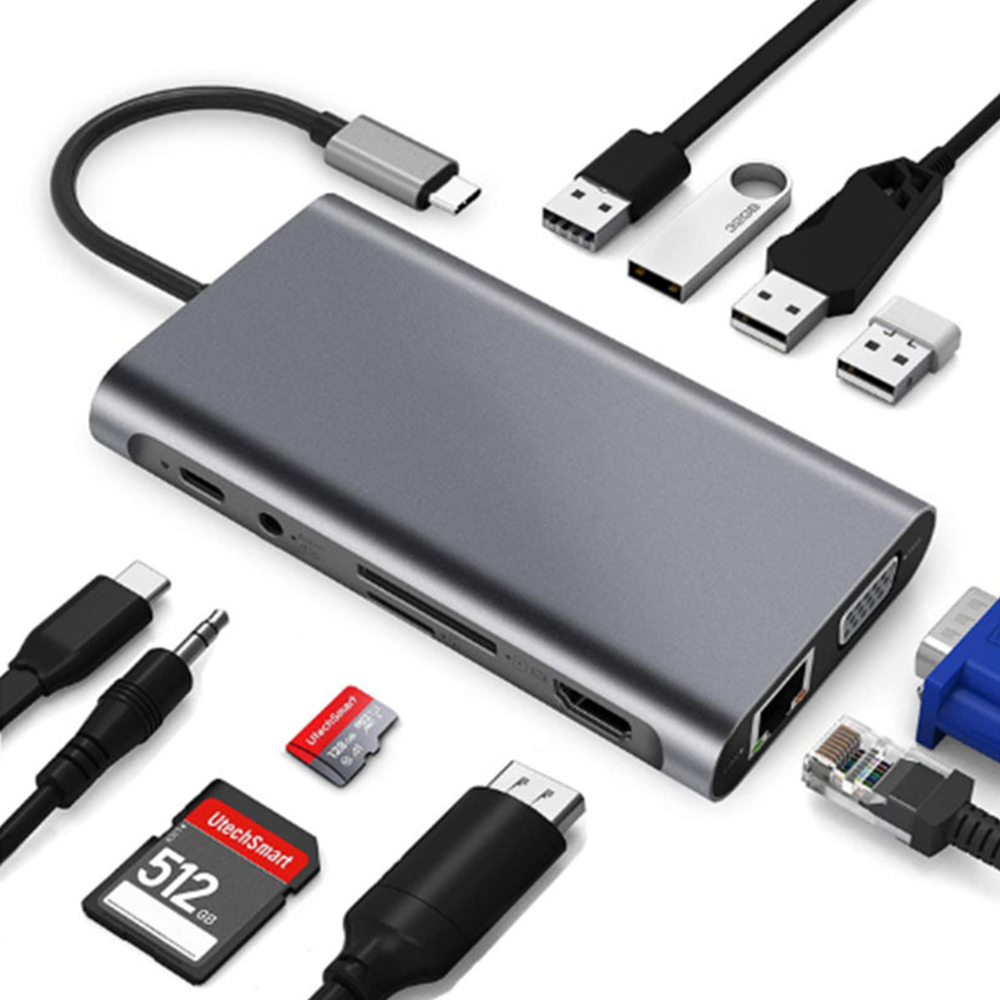 Grauer USB-C-Hub mit mehreren Anschlüssen, Kabeln und Speichergeräten.
