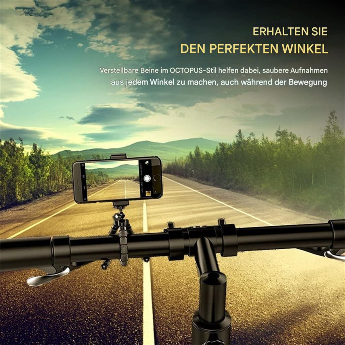 Ein Telefon auf einem Stativ an Fahrradlenkern. Das Bild zeigt eine Straße und einen Himmel.