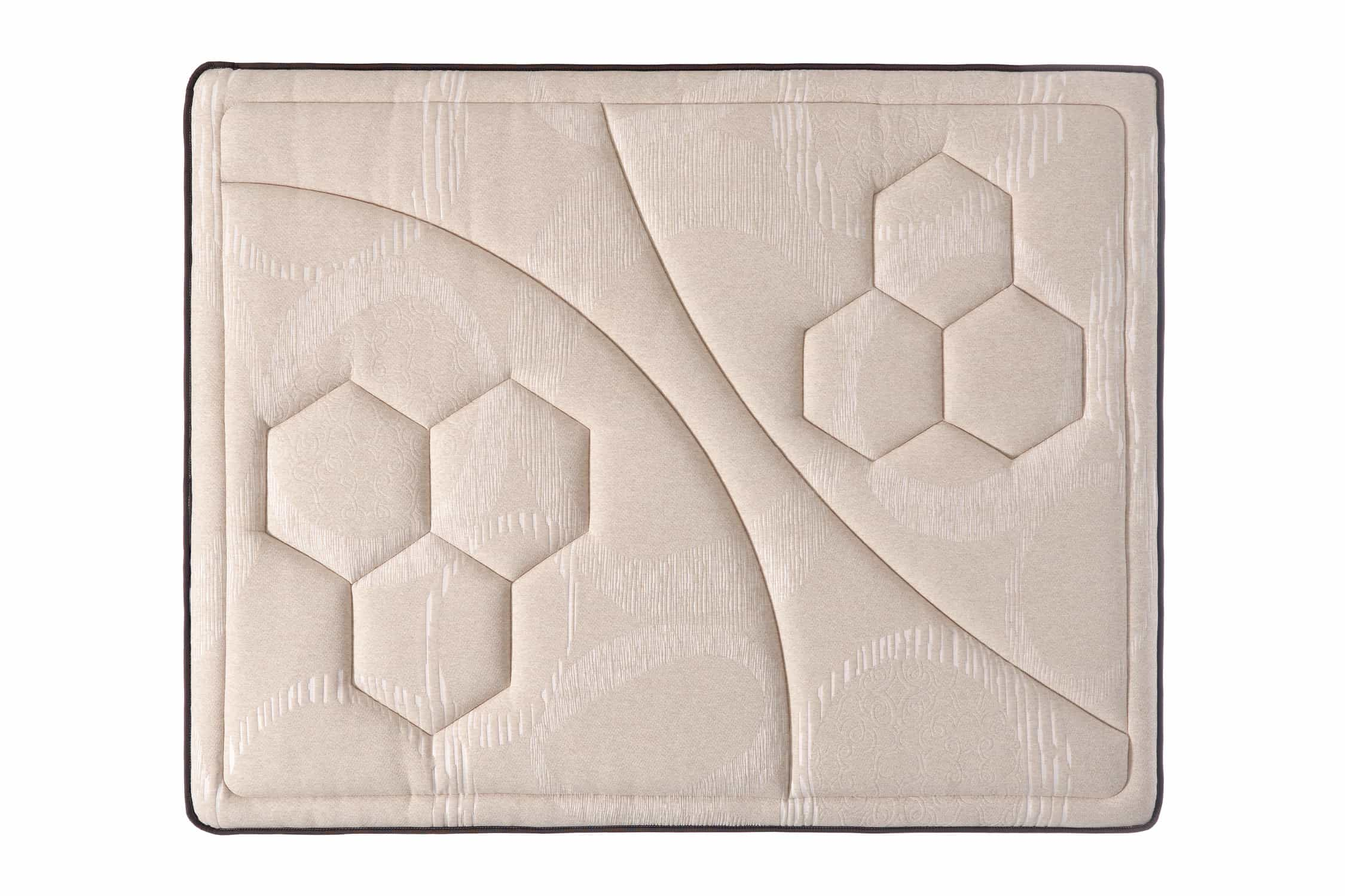 Vista superior de un colchón beige con diseño de panal y borde oscuro.