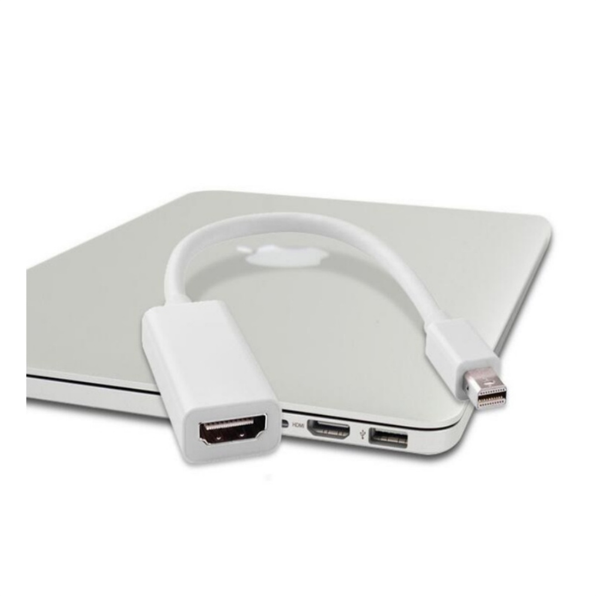 Weißes Adapterkabel, das mit einem Laptop verbunden ist, der Adapter befindet sich auf dem Laptop.