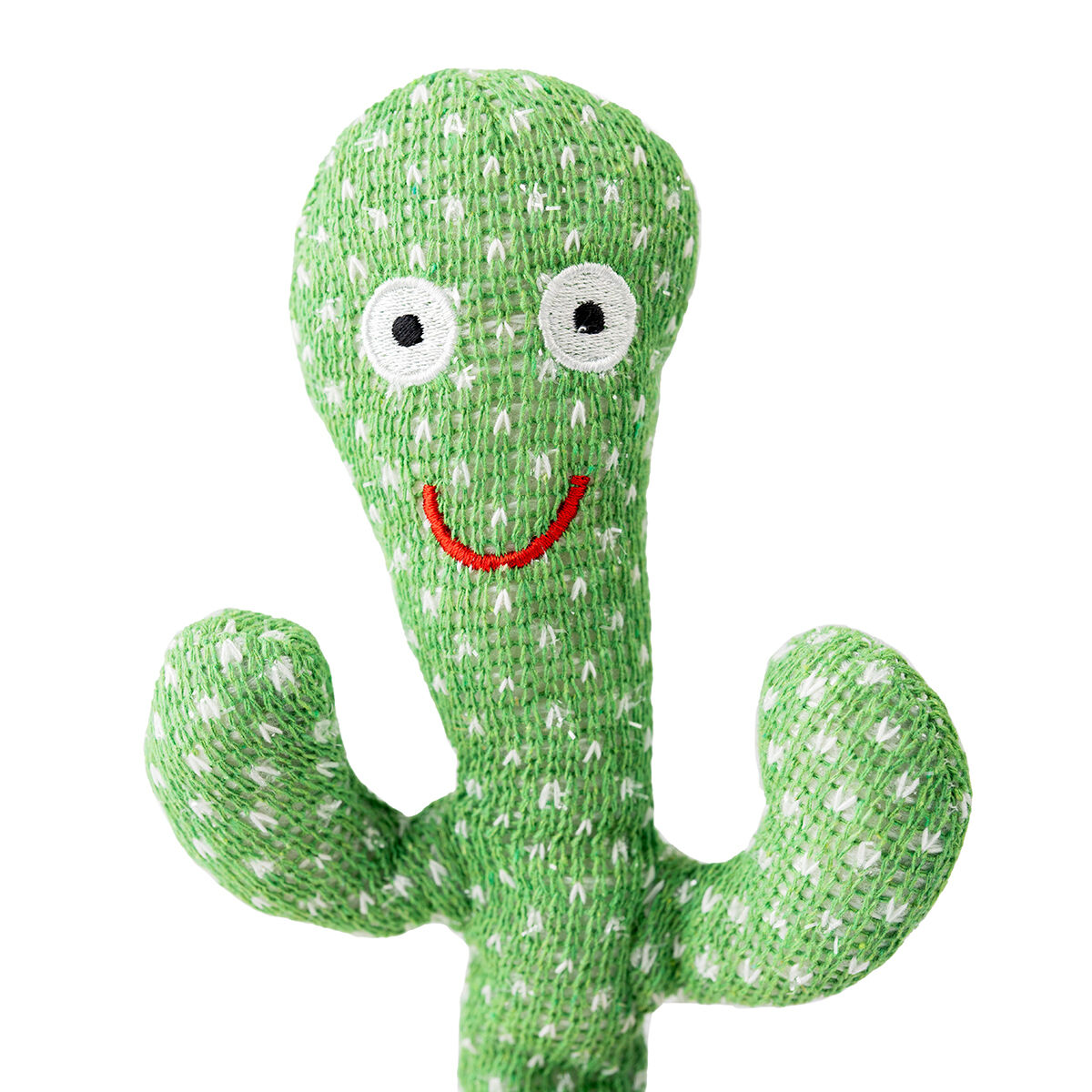 Primo piano di un giocattolo a forma di cactus verde con punti bianchi e una bocca rossa sorridente.