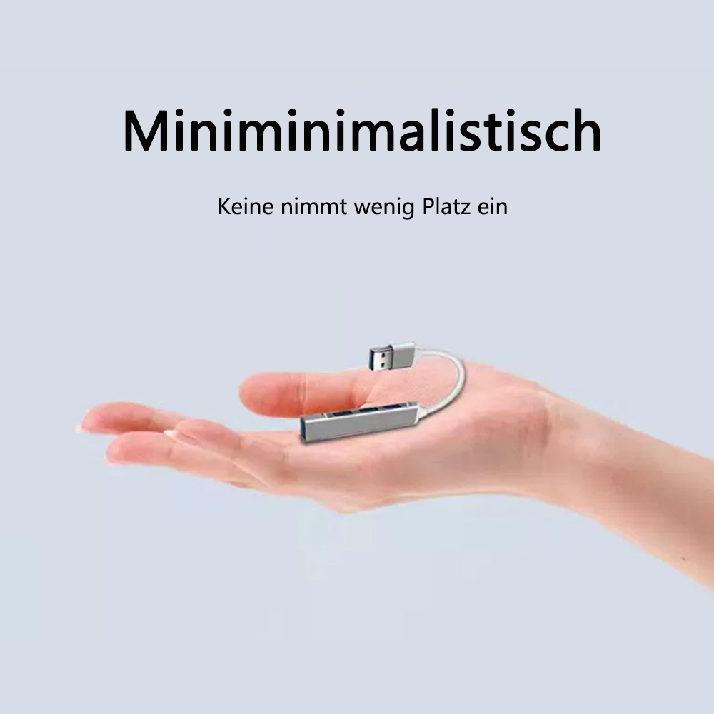 Eine Hand, die einen silbernen USB-Hub hält.