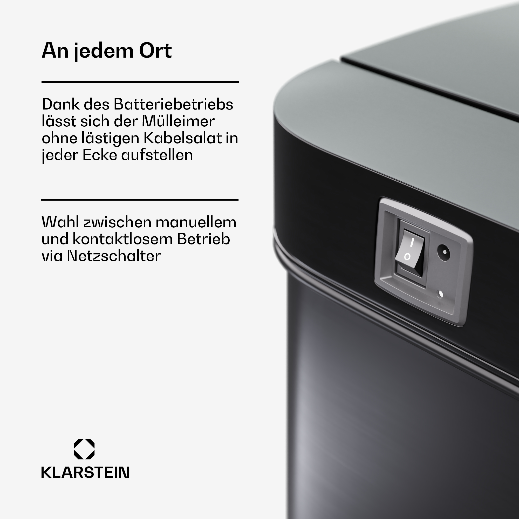 Nahaufnahme eines schwarzen Mülleimers mit Schalter. Text weist auf Batteriebetrieb und kontaktlosen Betrieb hin.