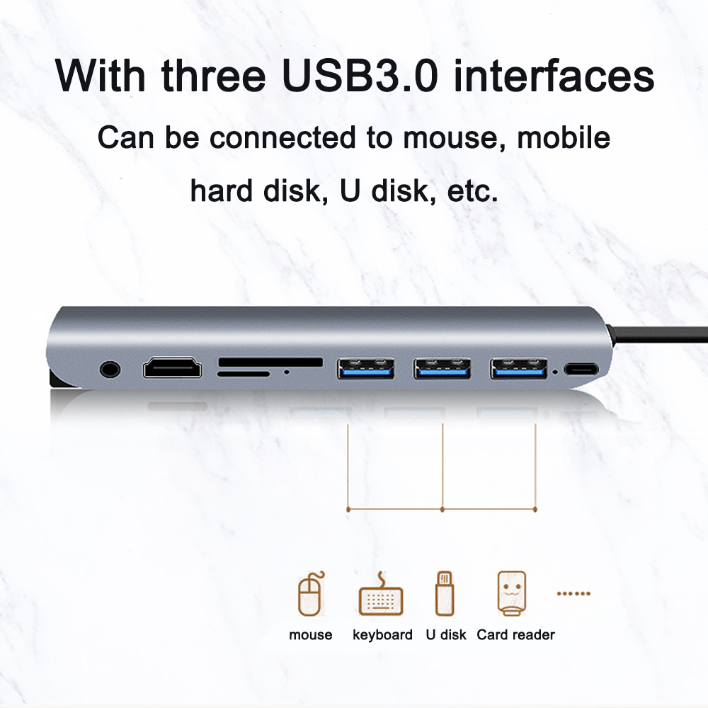 Silberner USB-Hub mit Anschlüssen. Maus, Tastatur, U-Disk-Symbole unten. Schwarzes Kabel, weißer Hintergrund.