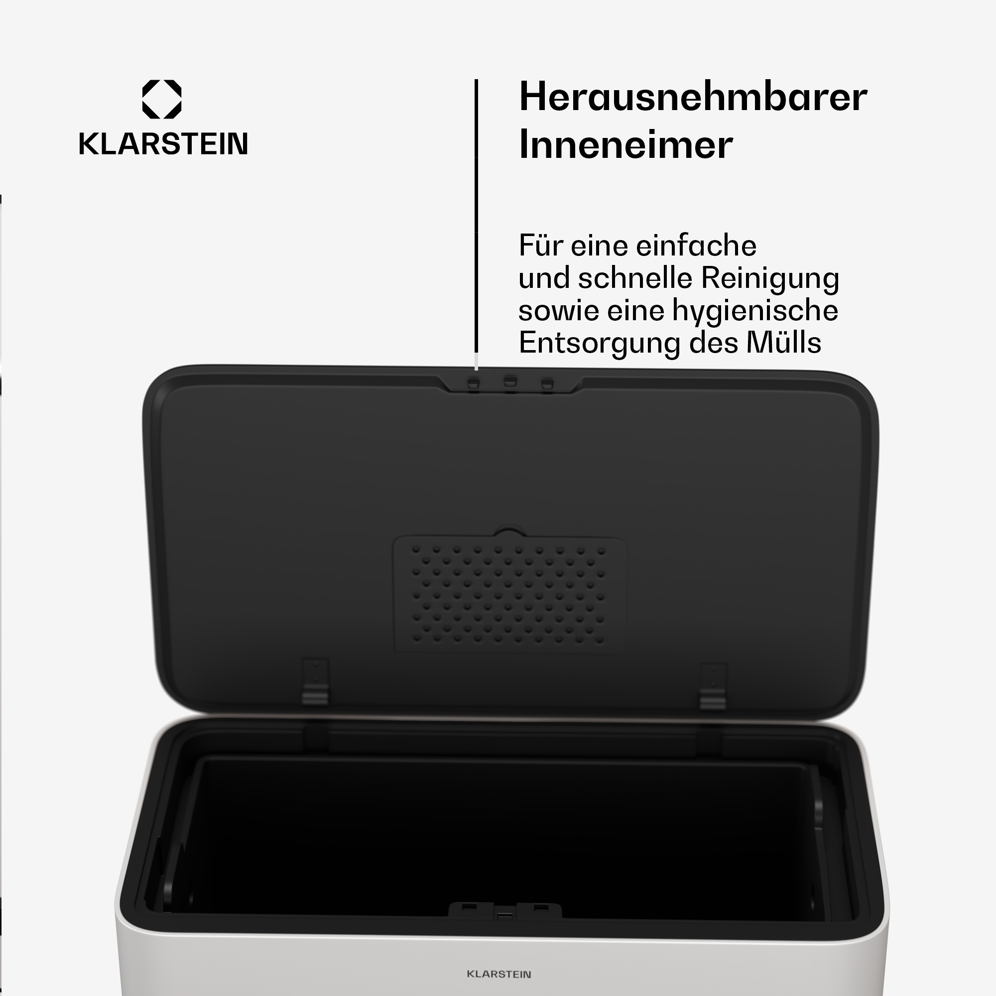 Ein weißer und schwarzer Mülleimer mit offenem Deckel, der einen schwarzen Innenraum zeigt.