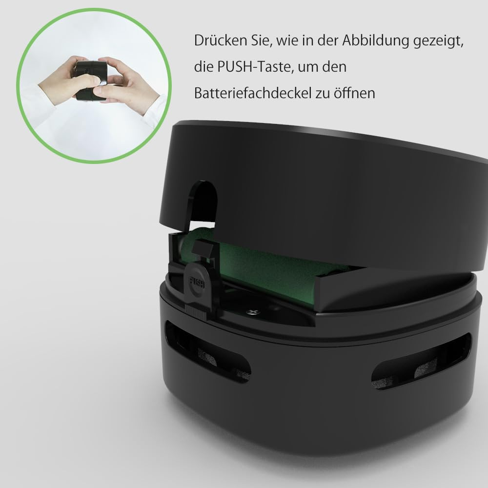 Schwarzes Gerät mit offenem Fach. Ein grünes Bauteil ist im Inneren sichtbar.