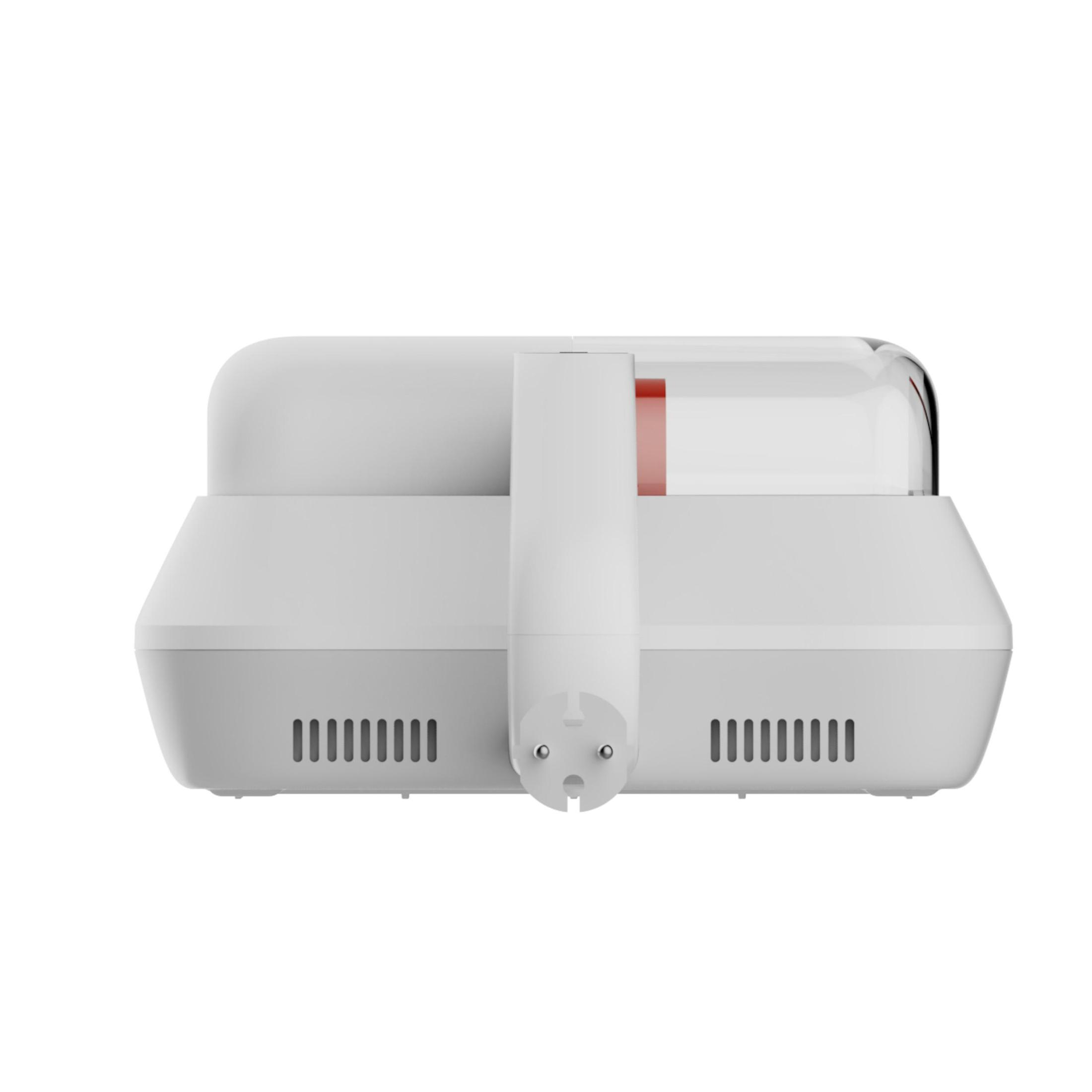 A white device with a handle and a power cord. It has a red cylinder inside.