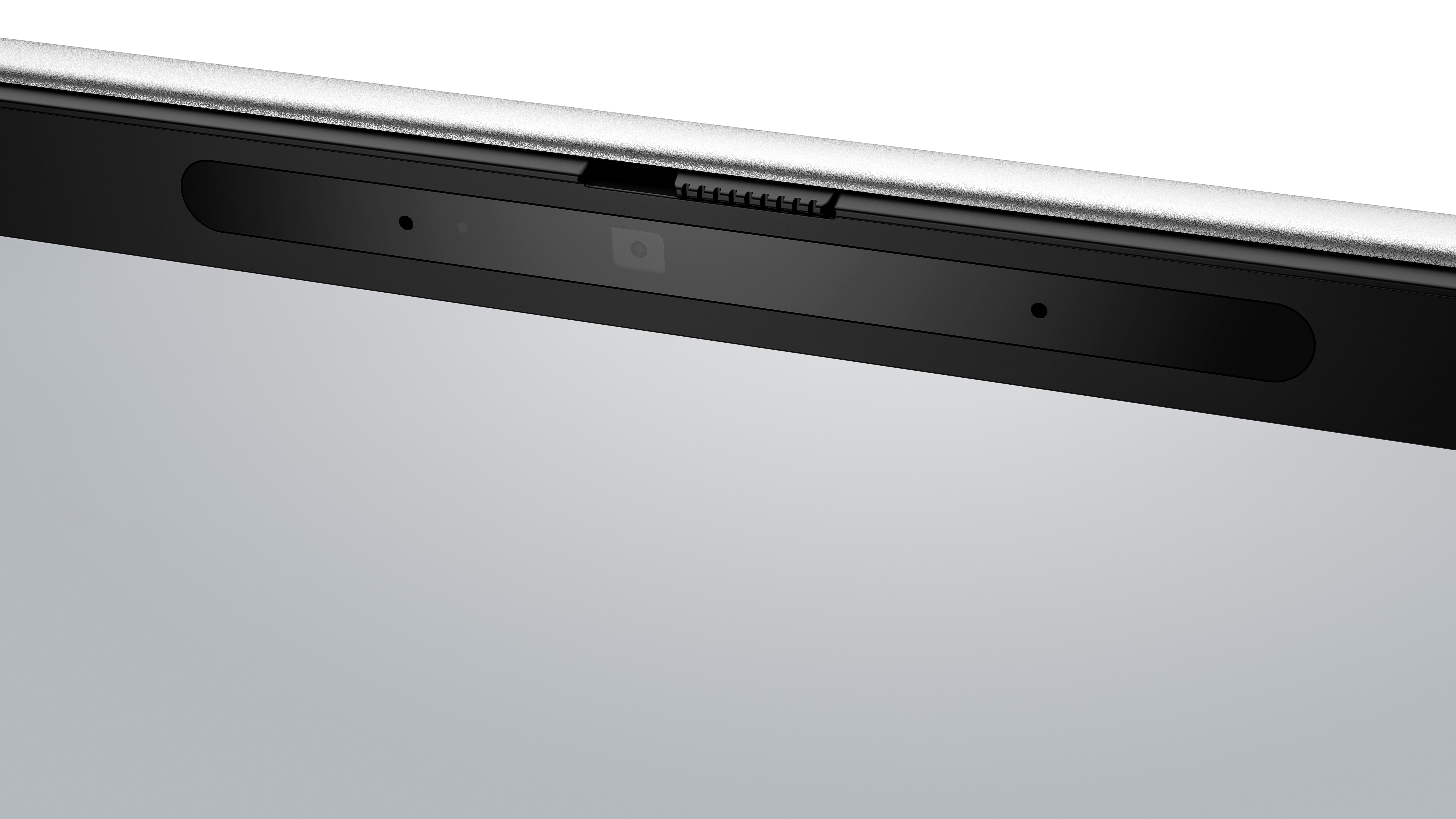 Kamera internetowa laptopa. Widok z góry na środek. Kamera znajduje się na czarnej ramce. Srebrna obudowa laptopa dookoła.