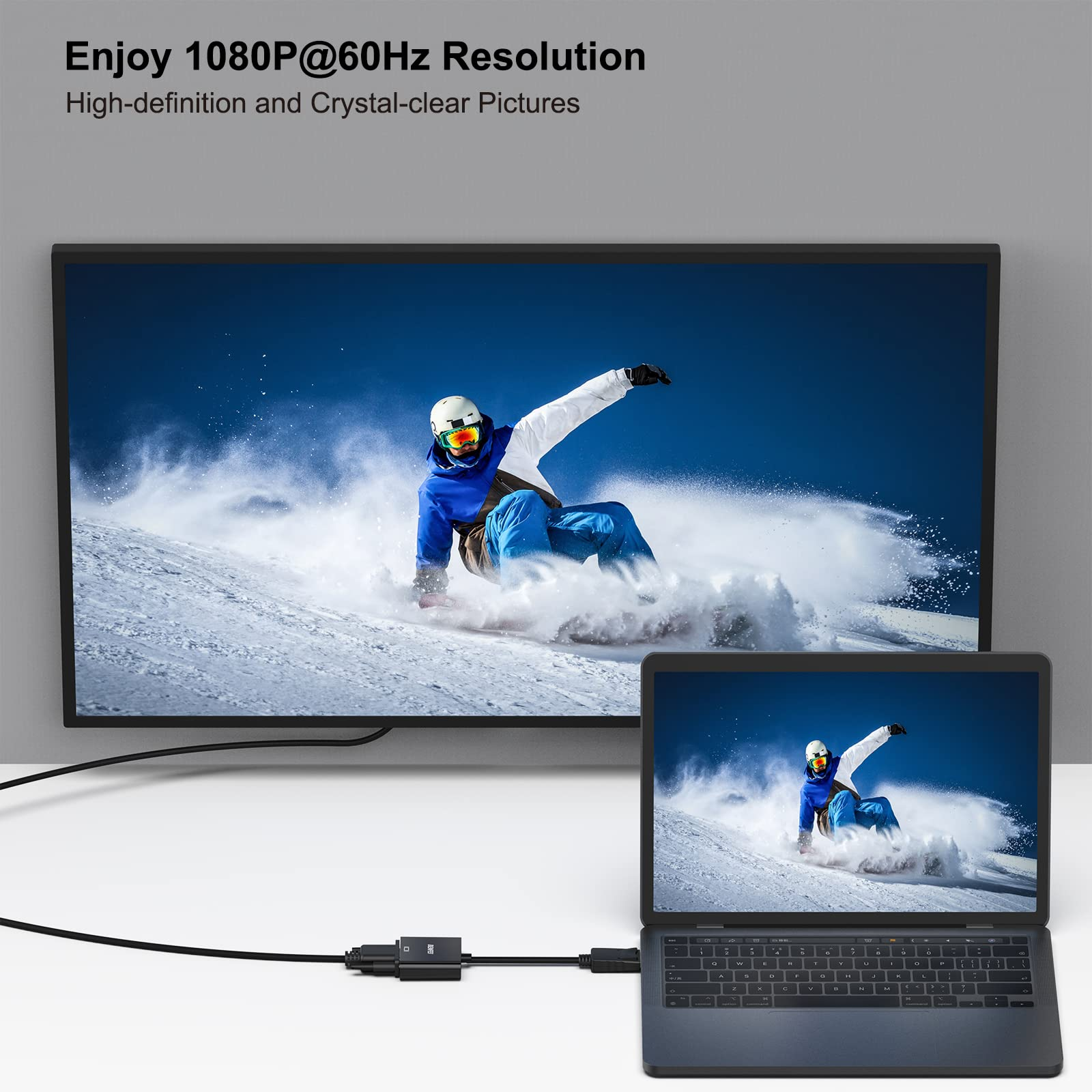 Laptop, der mit einem Monitor verbunden ist, der einen Skifahrer anzeigt. Zeigt ein schwarzes Kabel für das Display.