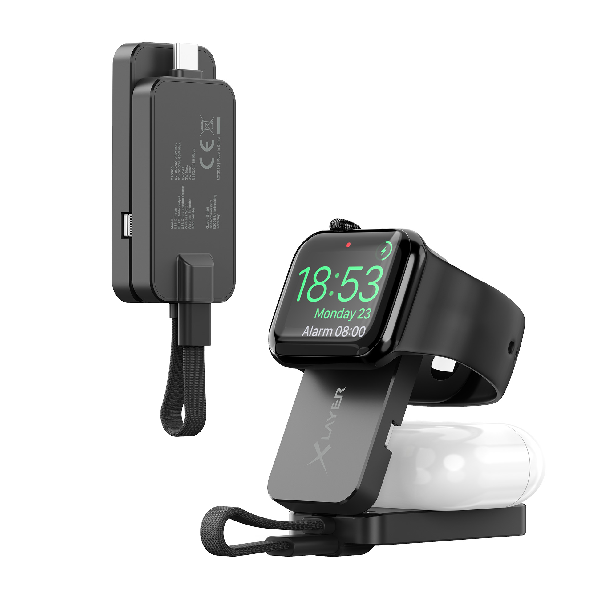 Eine schwarze Ladestation mit einer Smartwatch und Ohrhörern, alles auf weißem Hintergrund.