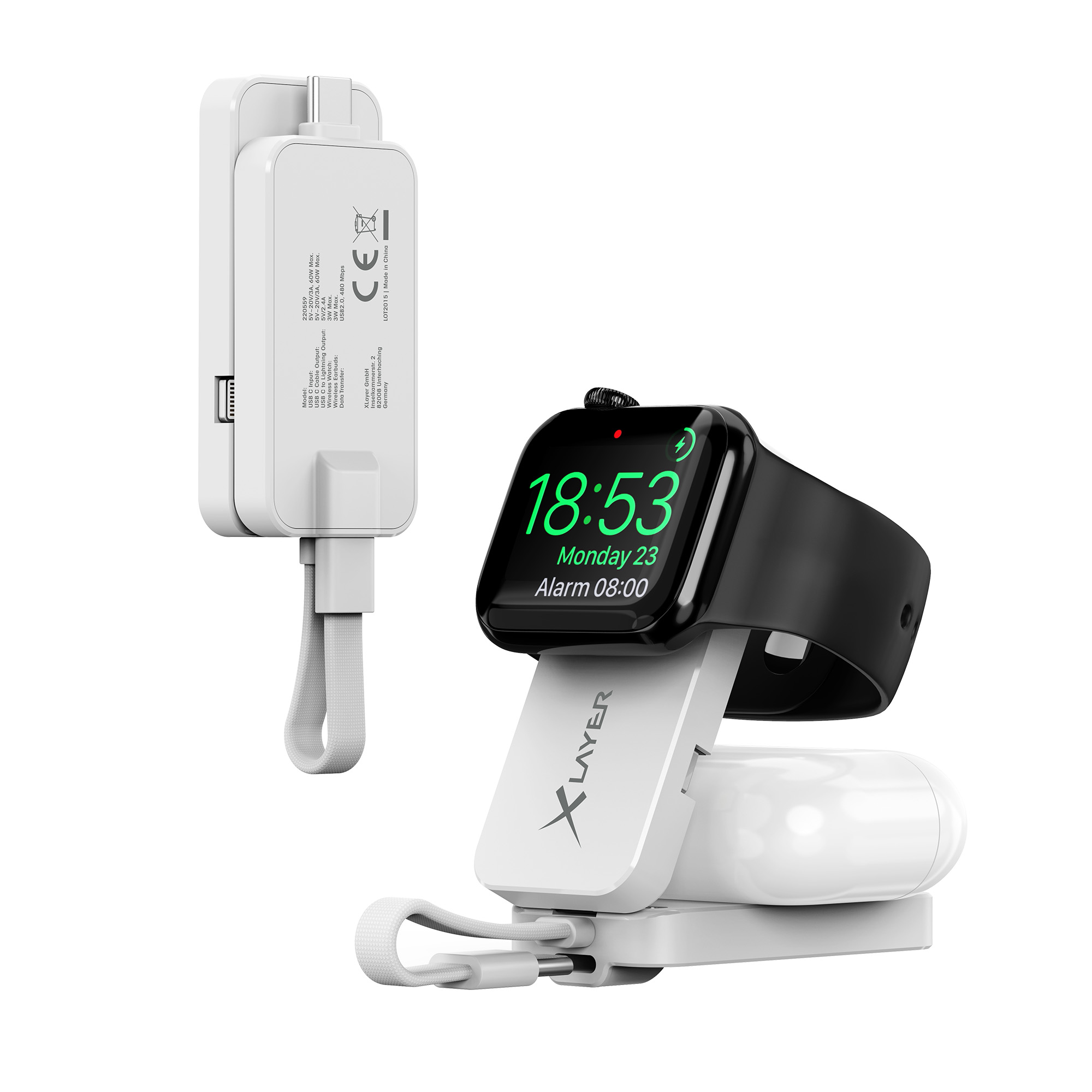 Ein weißes Ladegerät für die Uhr mit einer schwarzen Apple Watch, die die Zeit anzeigt.
