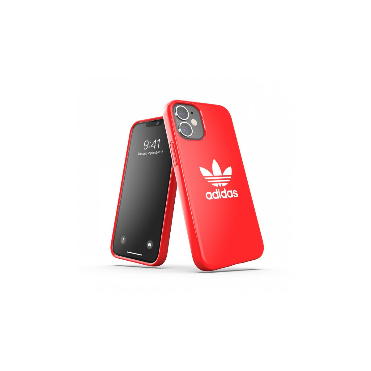 Due telefoni con custodie rosse Adidas. Uno mostra l'ora, l'altro il logo.