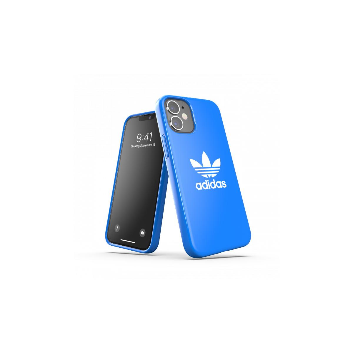 Custodia blu Adidas accanto al telefono nero. Logo Adidas sulla custodia blu.