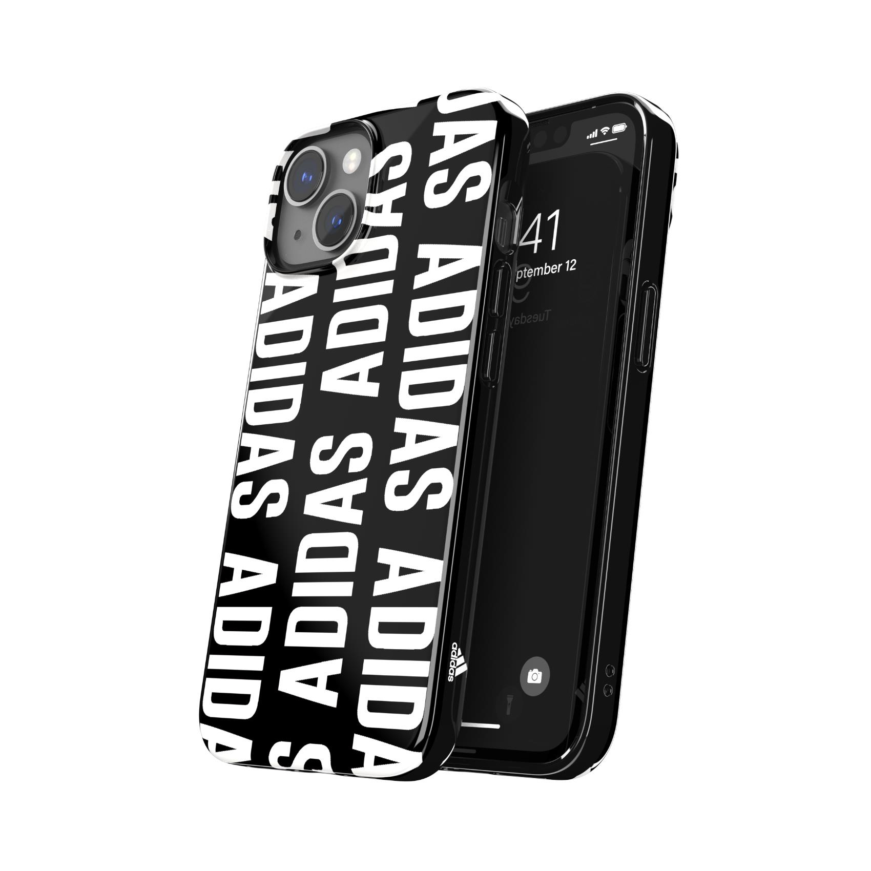 Una custodia nera con testo ADIDAS bianco. Accanto, un telefono con schermo nero.
