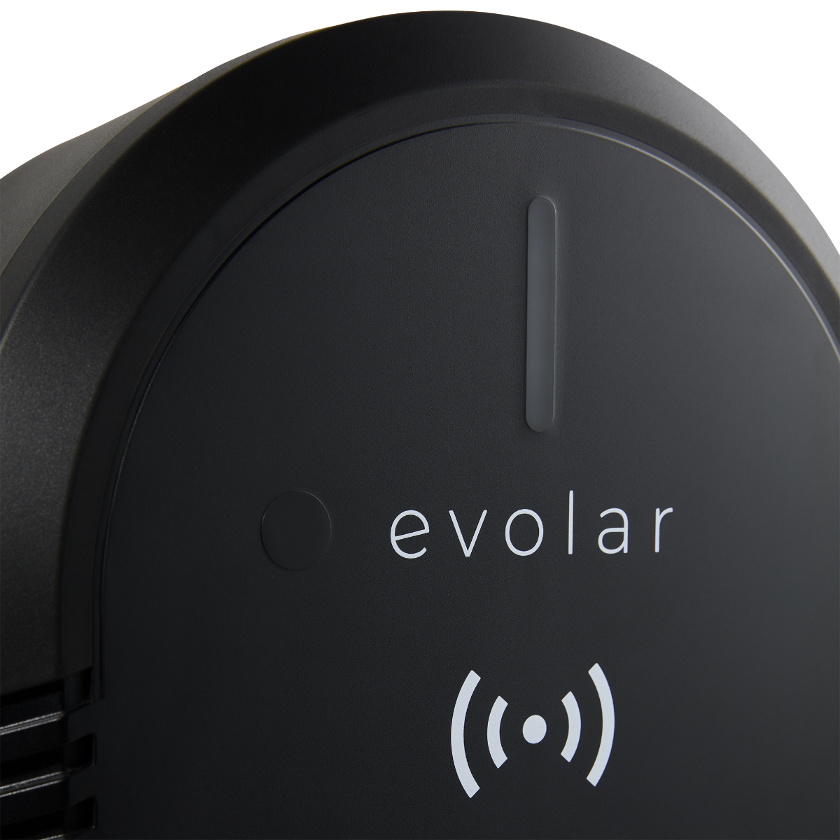 A close-up of a black electric vehicle charger with the text "evolar" and a wireless charging symbol.