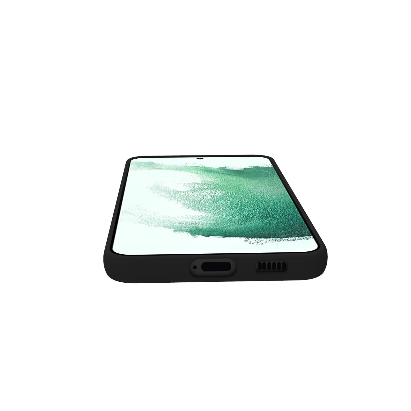 Telefono nero, a faccia in giù su una superficie bianca. Design a spruzzo verde e bianco sullo schermo.
