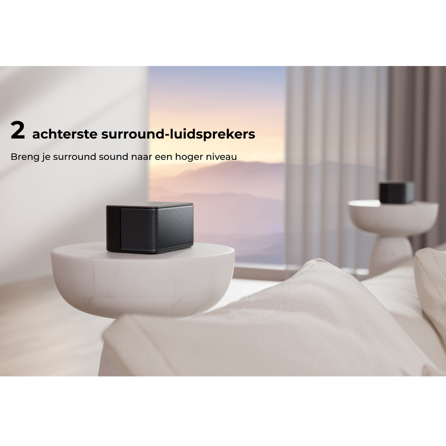 Black surround sound speaker on white marble table.