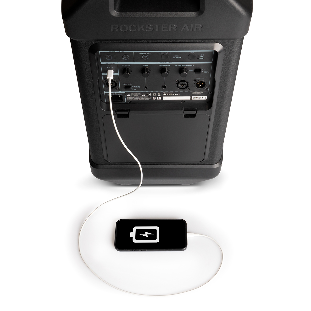 Zwarte luidspreker met telefoon die oplaadt. Telefoon is zwart met wit laadsymbool.