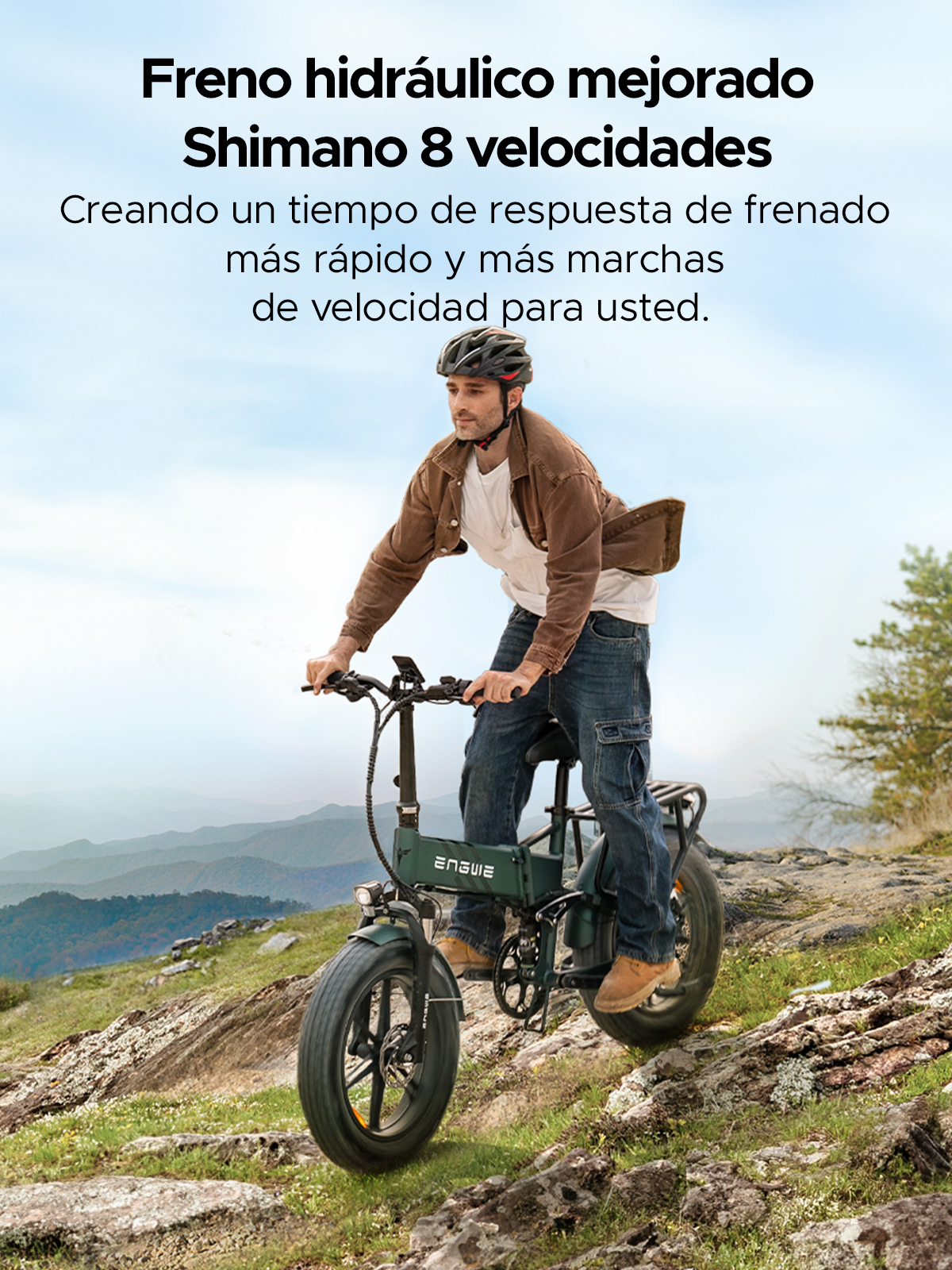 Mann fährt E-Bike auf Bergpfad. Text auf Spanisch oben.