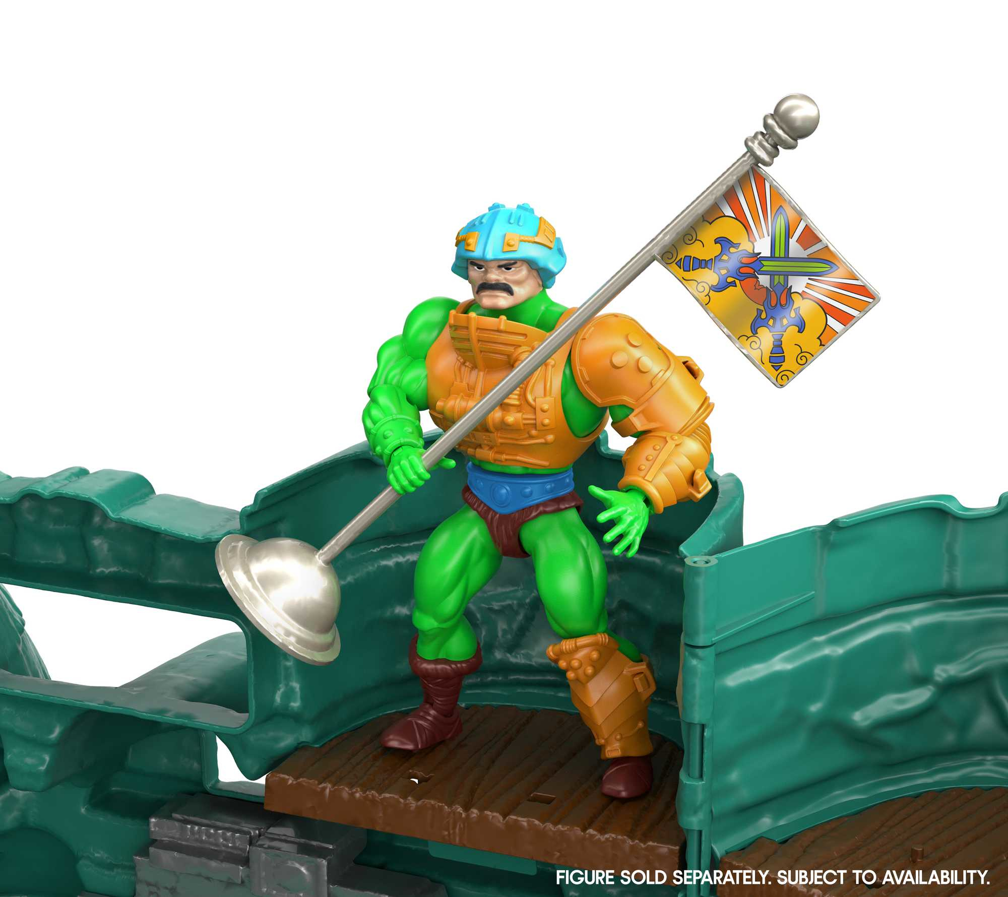 He-Man-Figur mit Fahne steht auf einem grünen Spielset.