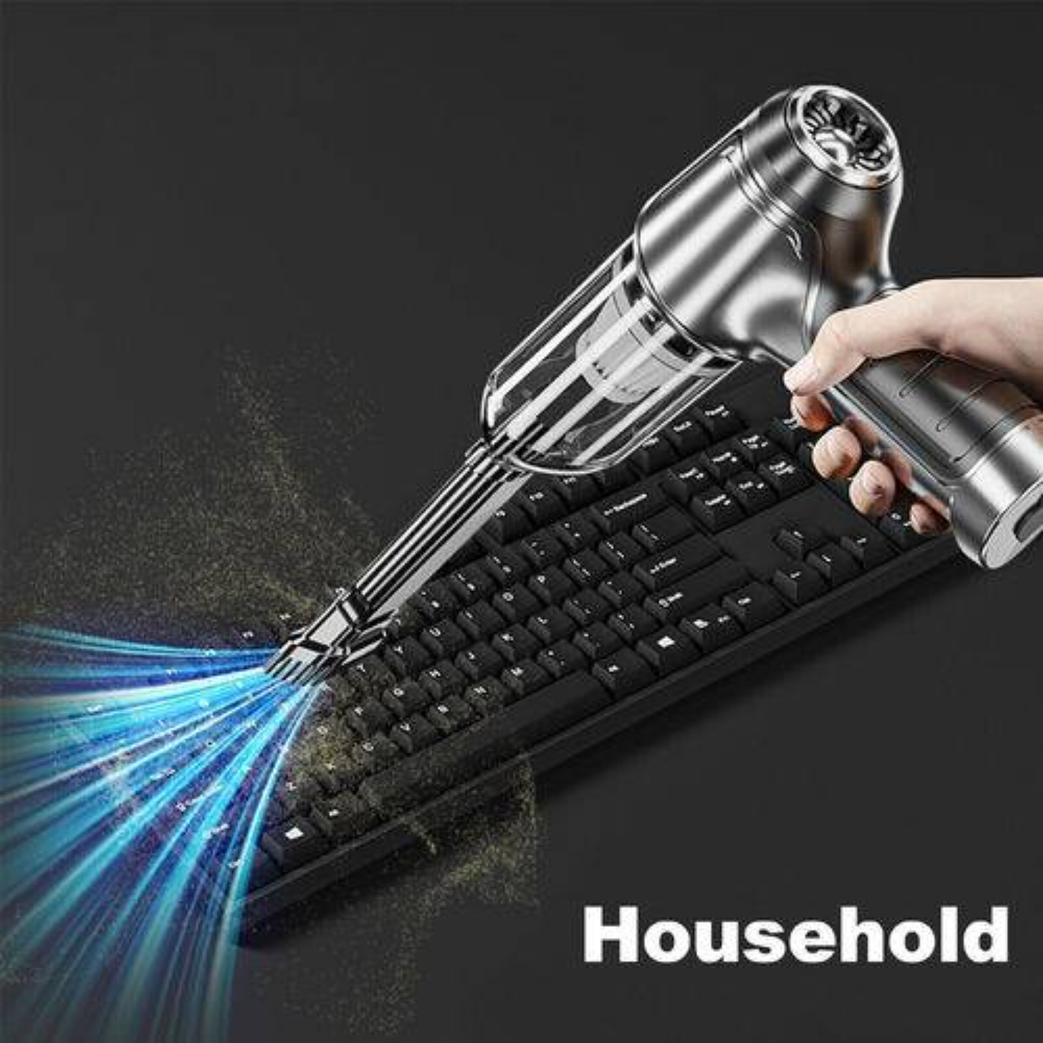 Handstaubsauger reinigt Tastatur, zeigt blauen Luftstrom und Haushaltsgebrauch.