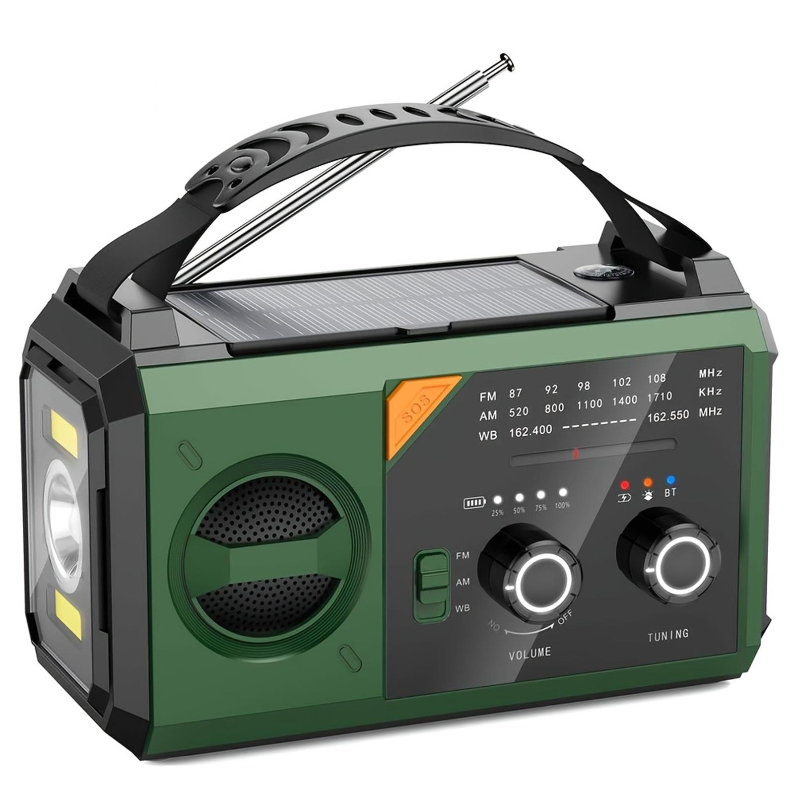 Grünes und schwarzes tragbares Radio mit Griff, Solarpanel, Taschenlampe.