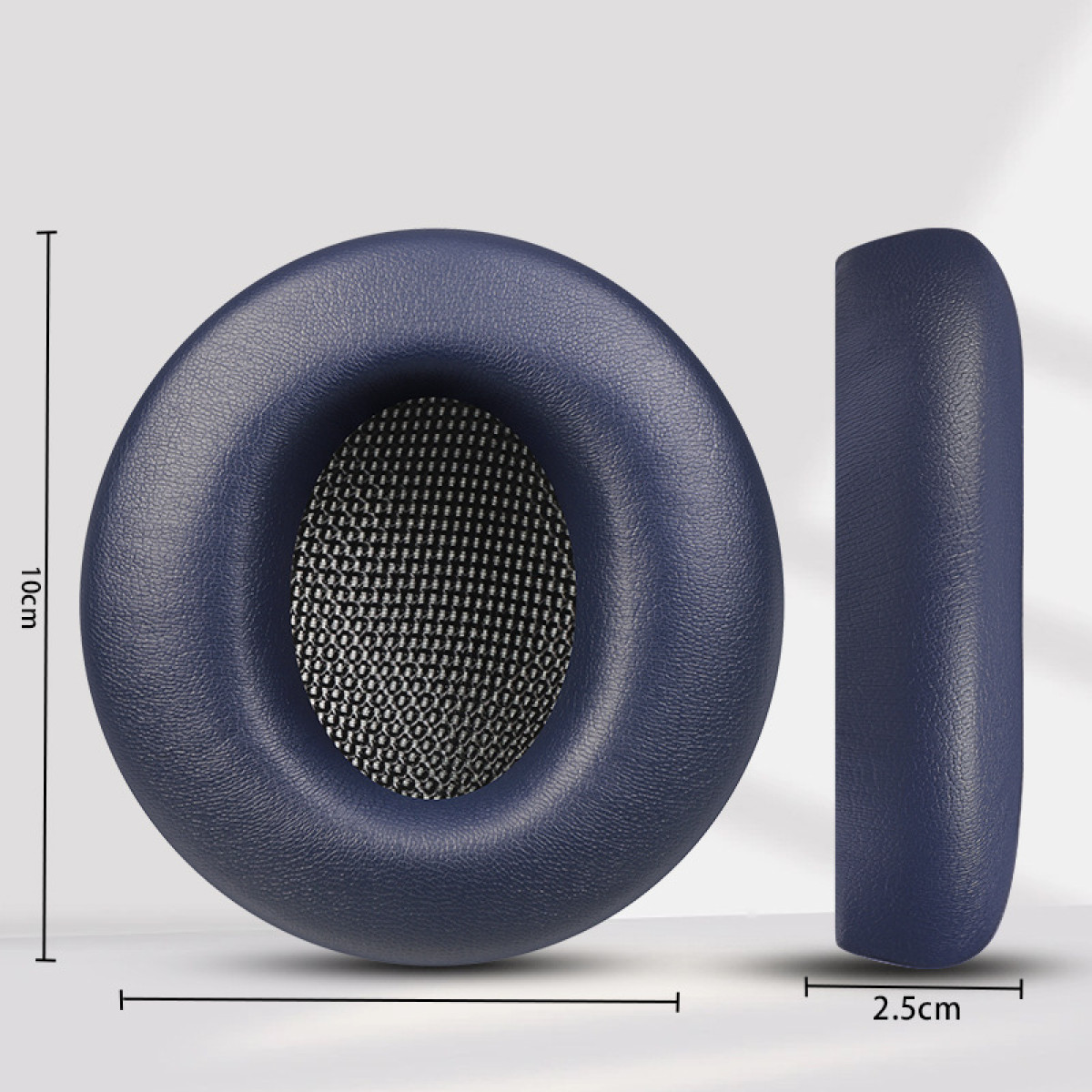 Un paio di cuscinetti auricolari blu per cuffie. Vista laterale con dimensioni segnate.