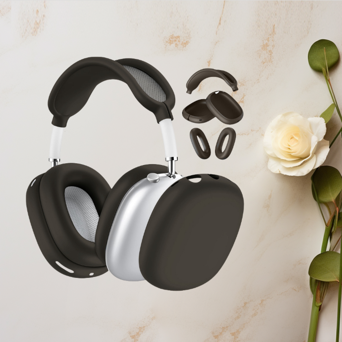 Auriculares, copas plateadas y diadema blanca, almohadillas y cubiertas negras. Fondo blanco.