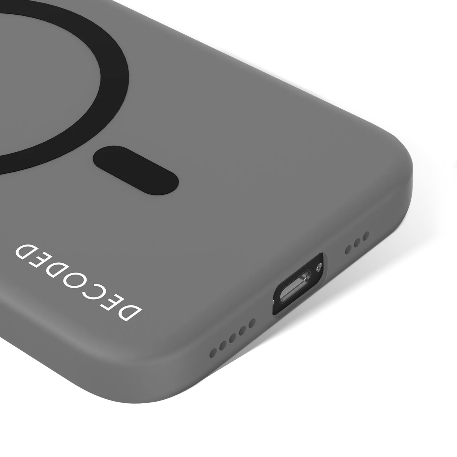Un primo piano di una custodia per telefono grigia con un MagSafe circolare nero e la scritta 'DECODED' è mostrato su sfondo bianco.