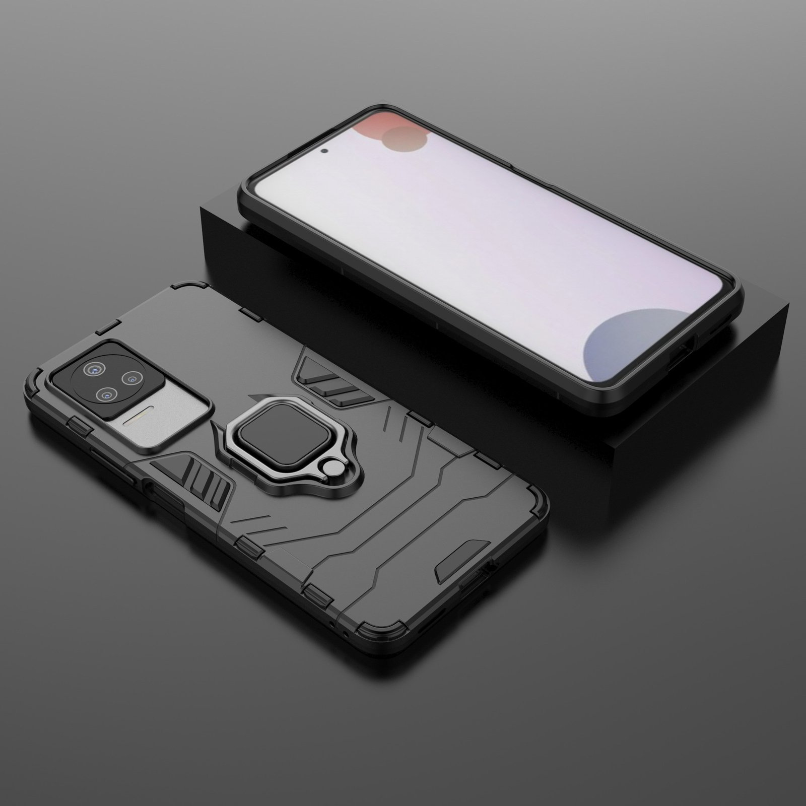 Funda negra para teléfono con soporte de anillo. El teléfono está encima de un bloque negro. La funda es negra.