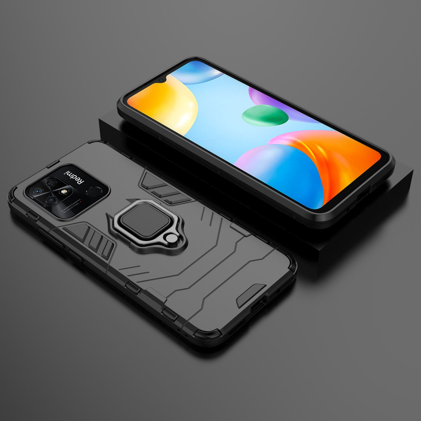 Dos teléfonos. Uno con funda, el otro sin. La funda es negra con soporte de anillo.