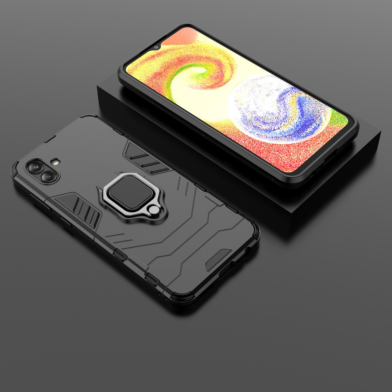 Funda negra para teléfono con soporte de anillo. El teléfono está sobre una superficie negra. La funda es negra.